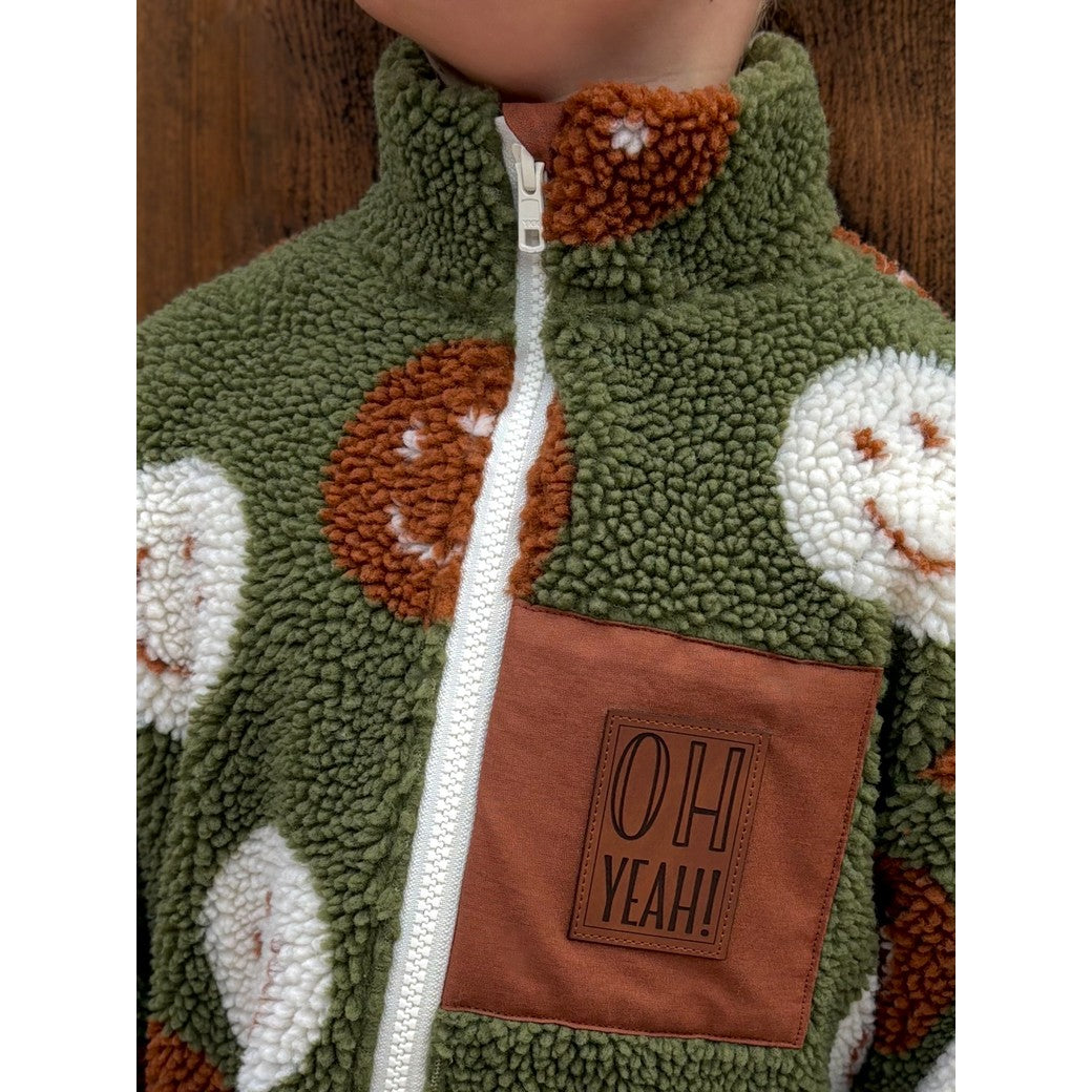 Teddystoff Jacquard Happy Faces grün rost